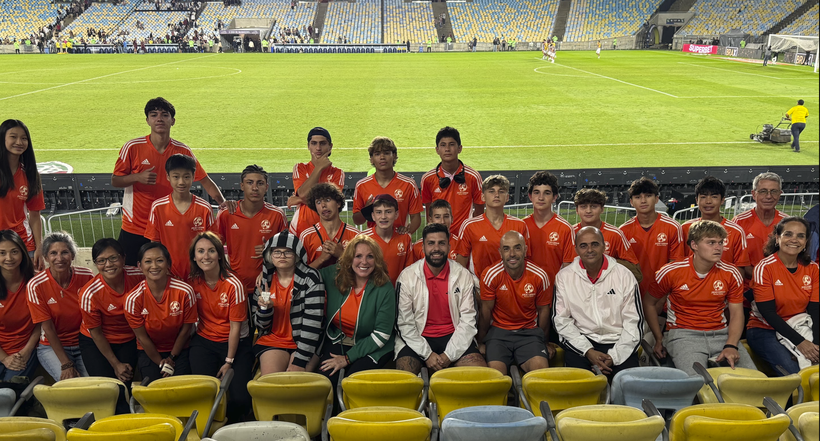 The group with families in the stands at the Maracanã